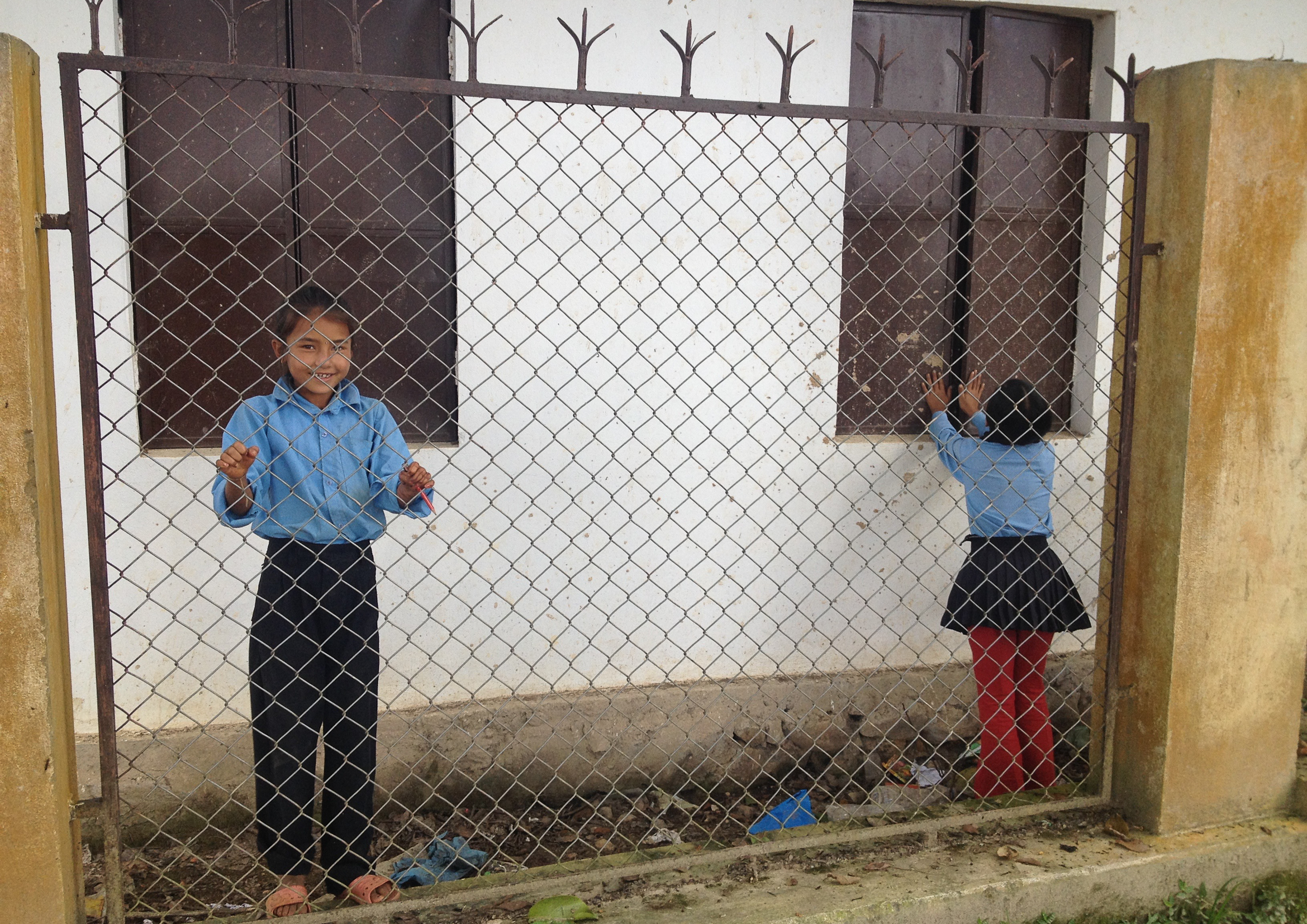 nepal school education fence boy girl