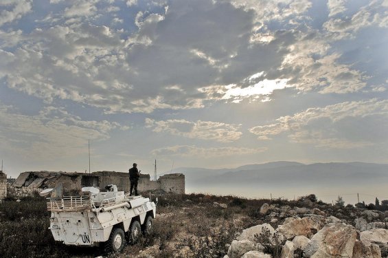 Military personnel of the United Nations Interim Force in Lebanon (UNIFIL)  on patrol in an armored personnel carrier.