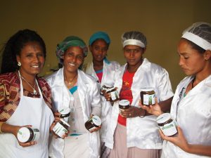 January 14 2015, Tigray, Ethiopia - Employees pose with Cactus Pear Marmelade jars at Tsega Gebrekidan Farm Cooperative. GCP/ETH/073/ITA : FAO partners with italian Gourmet Food Store Eataly to support a cooperative of Women ran by Tsega Gebrekidan Aregawi in Tygray, Ethiopia. The mission is part of a global project to support family farmers around the globe in boosting their production and finding ways to reach new overseas customers.