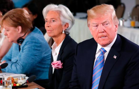 U.S. President Donald Trump, Managing Director of the International Monetary Fund Christine Lagarde and Germany's Chancellor Angela Merkel attend a G7 and Gender Equality Advisory Council meeting as part of a G7 summit in the Charlevoix city of La Malbaie, Quebec, Canada, June 9, 2018. REUTERS/Yves Herman