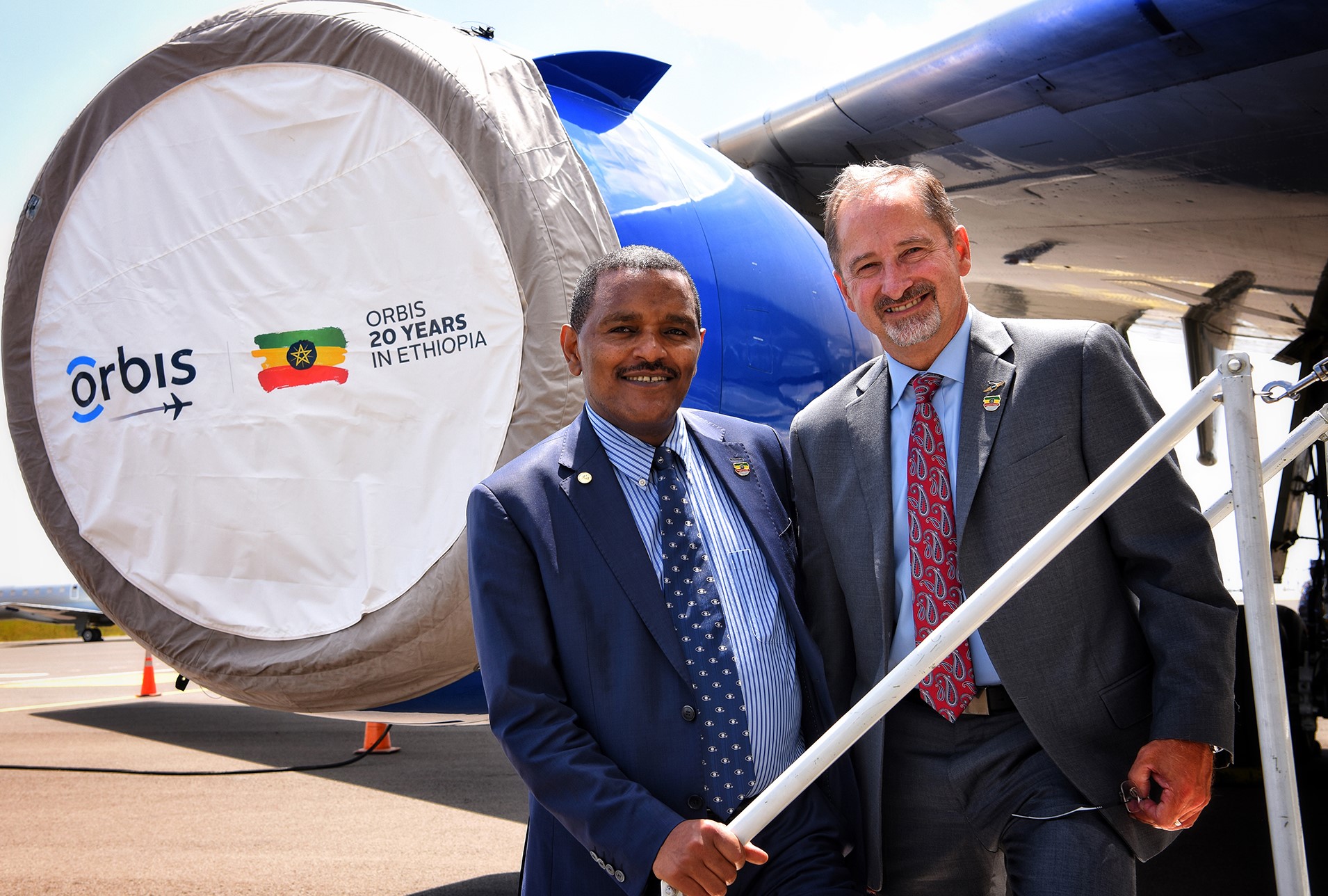 Orbis Flying Eye Hospital Program 
Addis Ababa, Ethiopia - October 1 - 19, 2018
Sponsored by the Alcon Foundation
--
Bob Ranck and the Honorable Dr. Kebede Worku, State Minister, Federal Minister of Health on the steps of the FEH at Bole International airport after the Opening Ceremony to kick off the program.