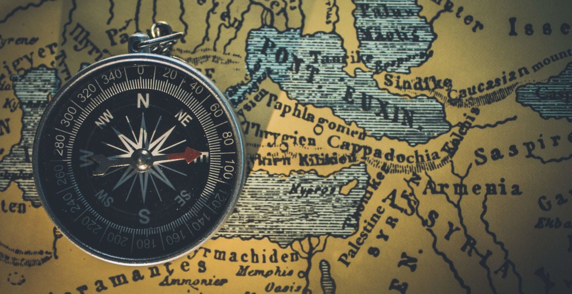 Compass and map showing borders and boundaries.