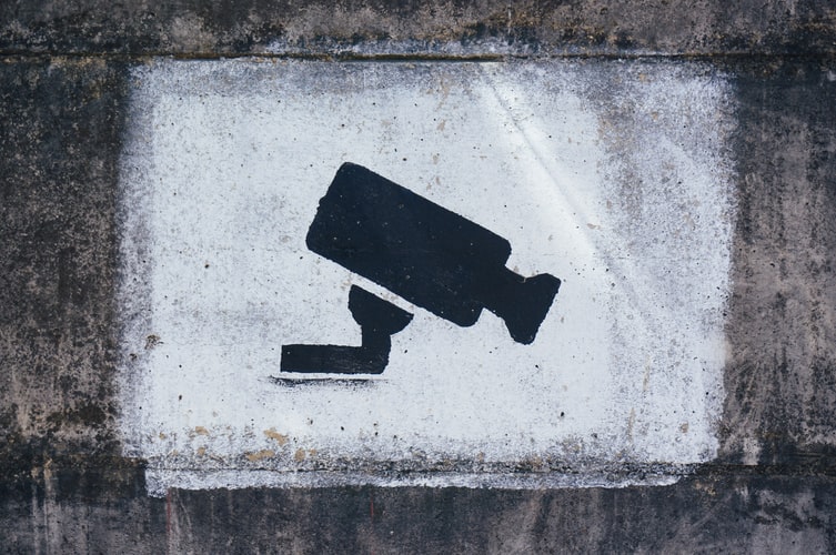 Graffiti of spy camera on wall