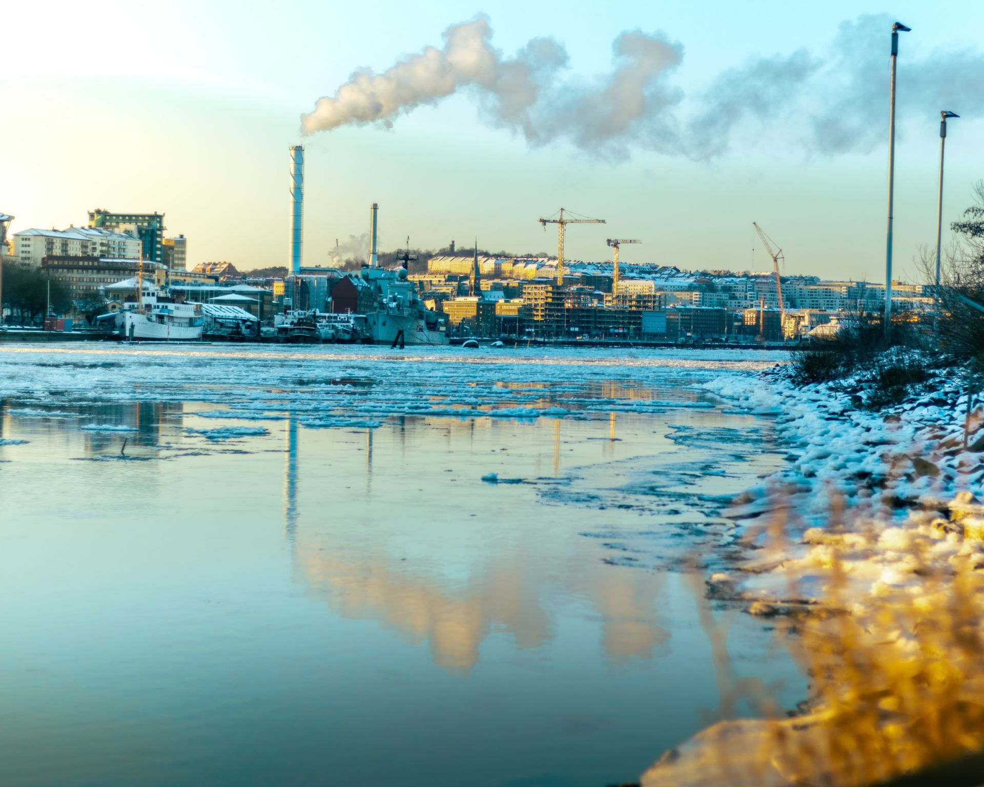 Factory polluting a nearby waterway