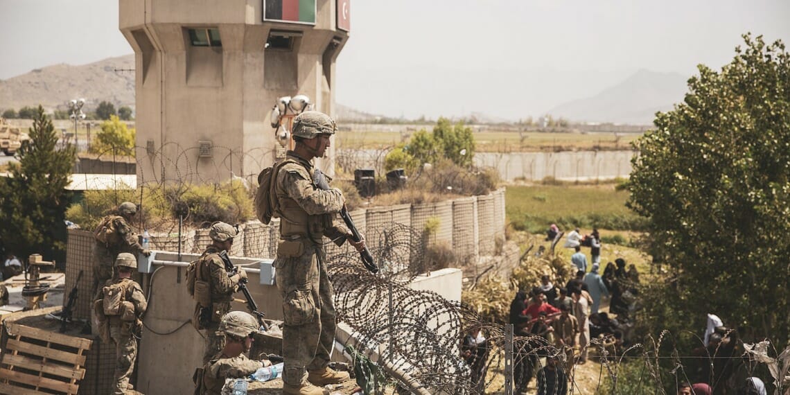 U.S. Marines assist with security at an Evacuation Control Checkpoint during an evacuation at Hamid Karzai International Airport, Kabul, Afghanistan, Aug. 20. U.S. service members are assisting the Department of State with a non-combatant evacuation operation (NEO) in Afghanistan. (U.S. Marine Corps photo by Staff Sgt. Victor Mancilla)