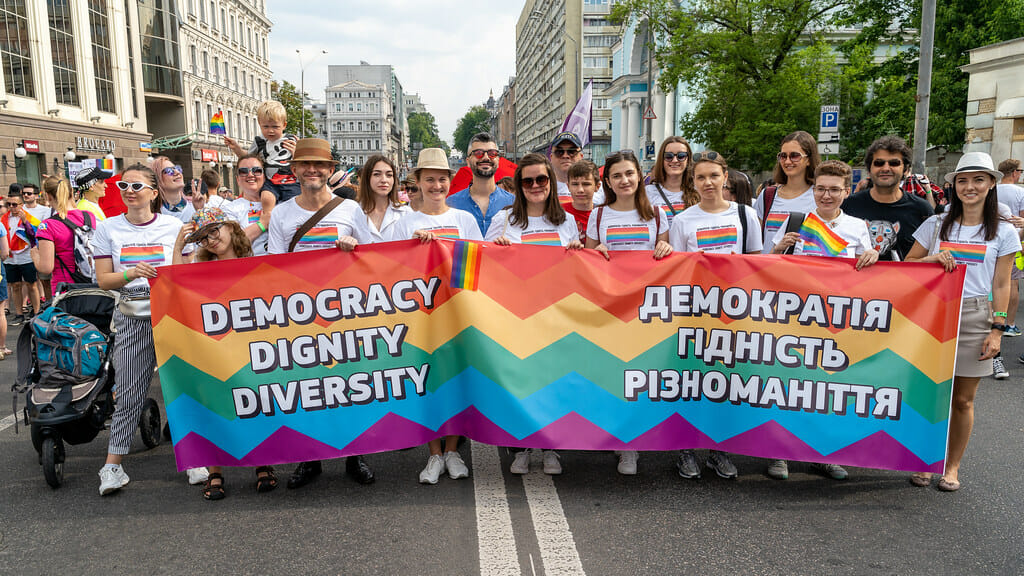 LGBTQ+ group hold sign at Pride in Ukraine