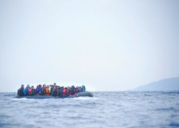 inflatable boat filled with immigrants at sea