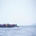 inflatable boat filled with immigrants at sea