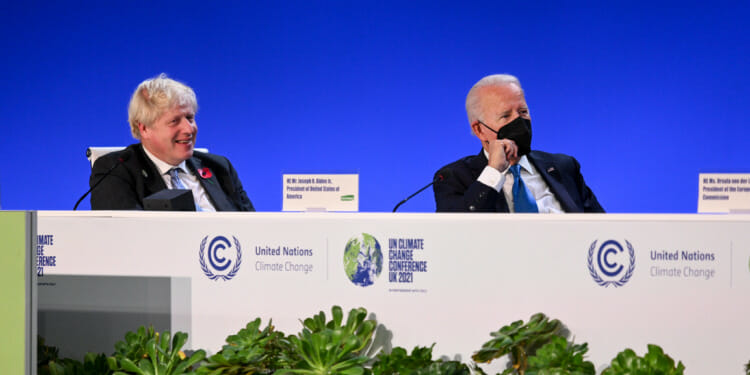 Two men talking at COP26