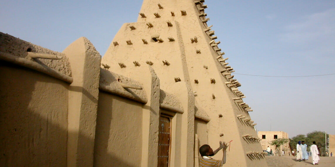 boy in front of mausoleum
