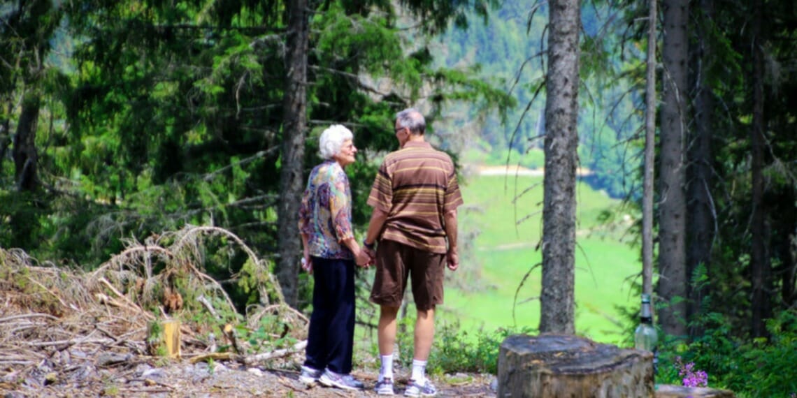 Two People Standing in Forest Credit: Magda Ehlers via Pexels