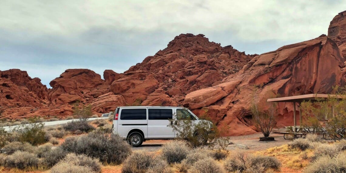 Van Parked in Desert Credit: Deemoun via Pixabay