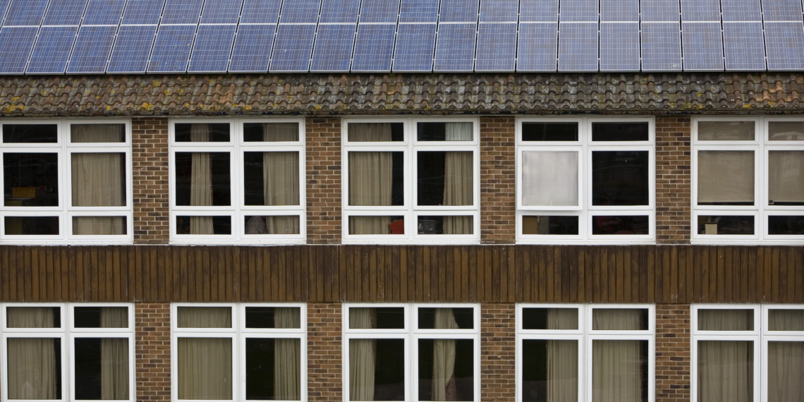 Solar PV Photo Voltaic panels on the roof of Ringmer community college, Ringmer; East Sussex. This panel, or module, is made up of photovoltaic (PV) cells. PV cells convert sunlight into electrical energy.