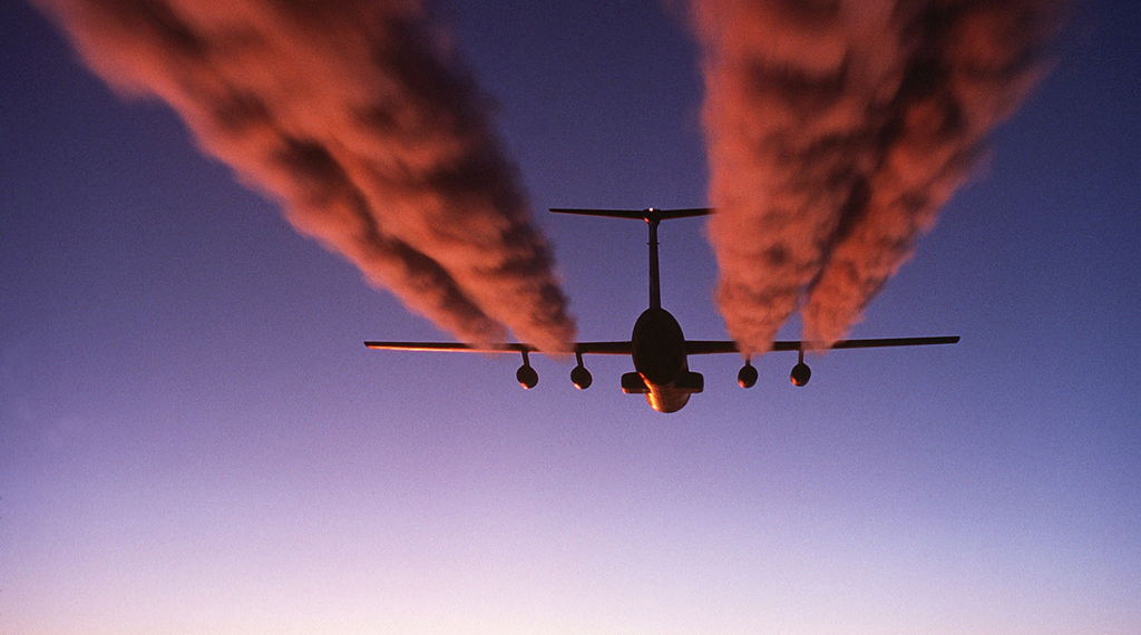 A plane emitting carbon dioxide into the atmosphere