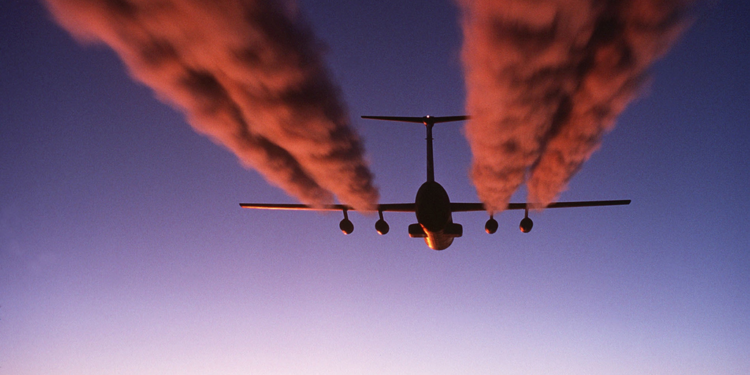 A plane emitting carbon dioxide into the atmosphere