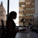 A woman sitting at her desk