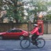 Bicycle and car in London ULEZ Expansion
