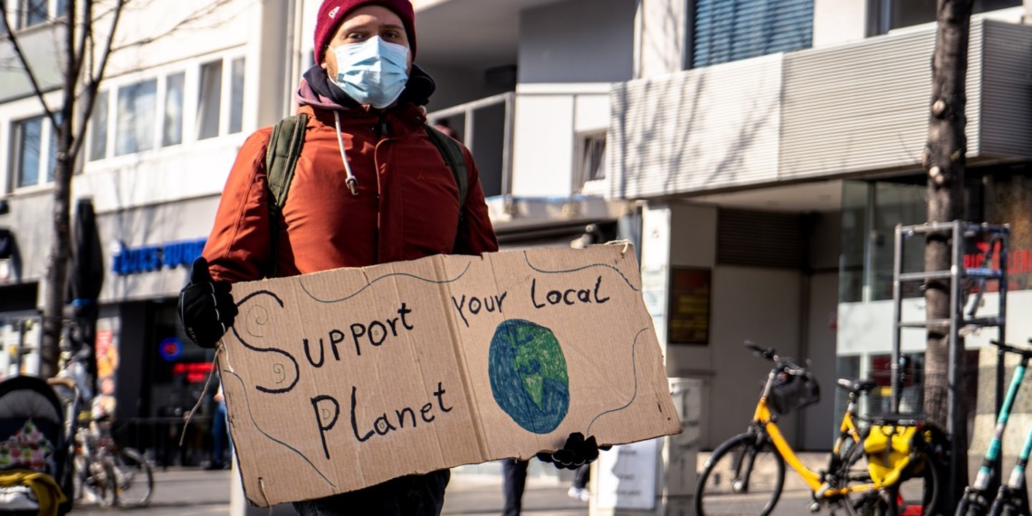 A protester marching with a sign.