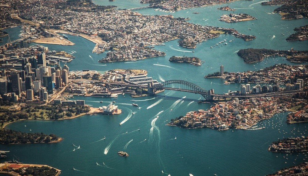ESG news regarding Australia climate risk report, Iraq-TotalEnergies deal, UK-US nuclear pact, and Australia rooftop solar boom