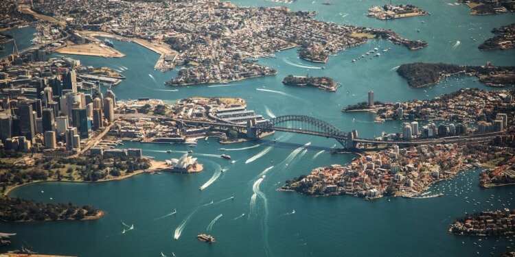 ESG news regarding Australia climate risk report, Iraq-TotalEnergies deal, UK-US nuclear pact, and Australia rooftop solar boom