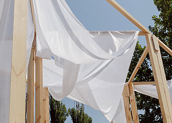 Young designers presenting sustainable prototypes at Creathon 2025 in Almaty’s Botanical Garden.