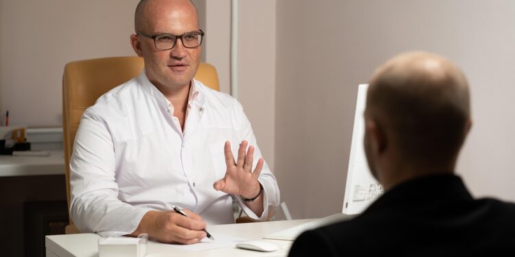 A doctor helping a patient to deal with Medicaid