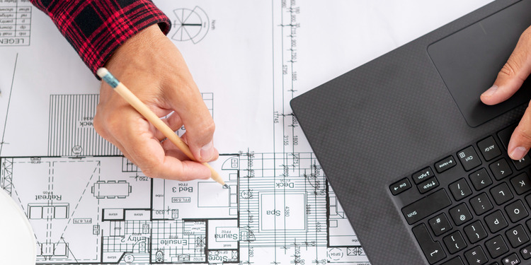 Construction Planning: Top view architect working on his project