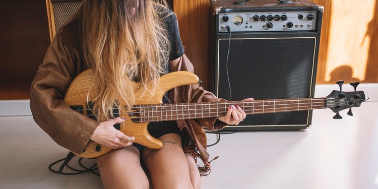 Woman playing an Electro-Acoustic Guitar
