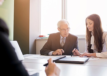 Defense attorney and Legal Specialists at work.