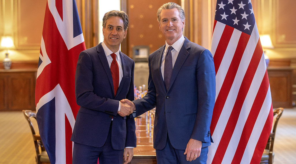 ESG News regarding Trump criticizing Newsom over UK green energy agreement, new analysis questioning the climate benefits of AI, EU greenlighting €1.04 billion Danish programme to reduce farm emissions and restore wetlands, and Santos winning court case over alleged misleading net-zero claims.