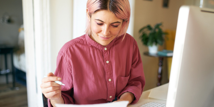 A woman going through the checking account guide