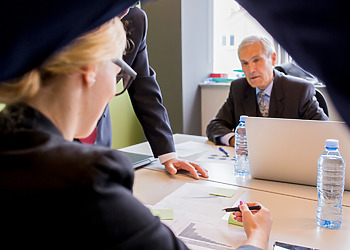 3 Fraud Offences Lawyers in the office going through a case review.