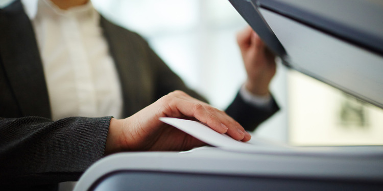 A woman sending a PDF as a Fax From her Computer.