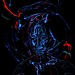 An abstract robotic figure is surrounded by glowing lines