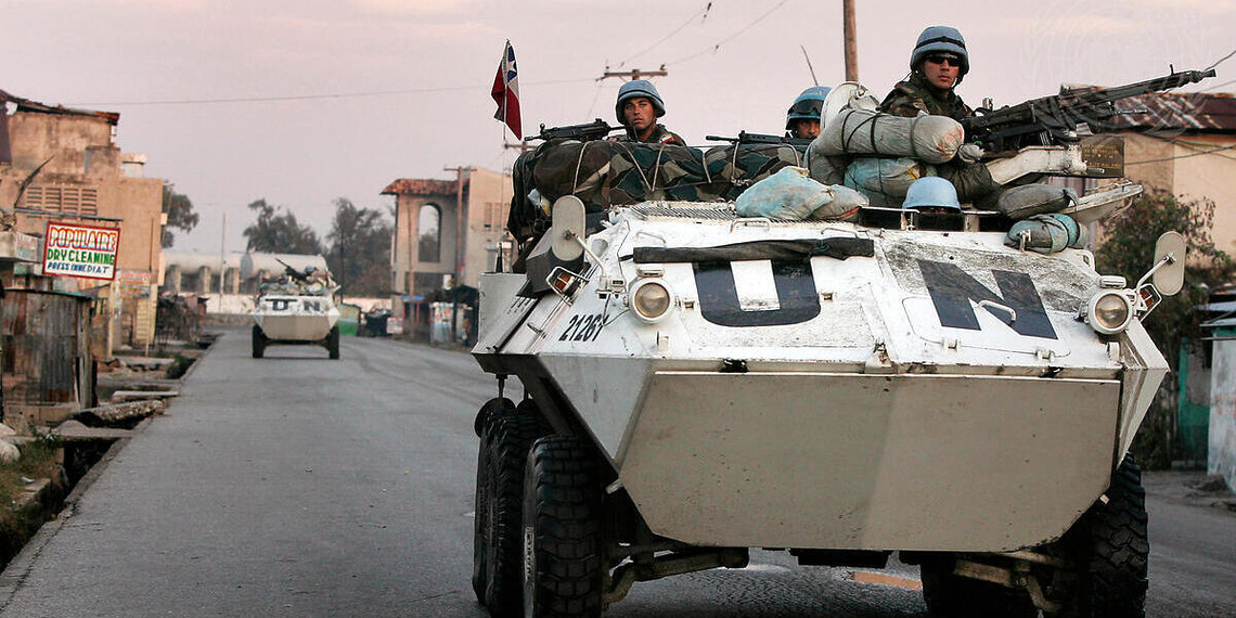 Chilean UN peacekeepers patrol the Cité Soleil neighbourhood of Port-au-Prince during an operation to restore order in the area by the United Nations Stabilization Mission in Haiti (MINUSTAH), after three hours of heavy fighting between gangs, Haiti, Feb. 9, 2007. Photo Credit: UN Photo/Logan Abassi