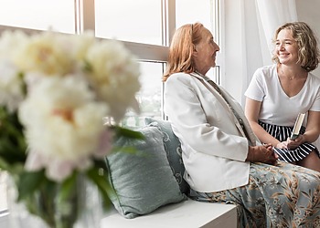 Mother and daughter handling assisted living