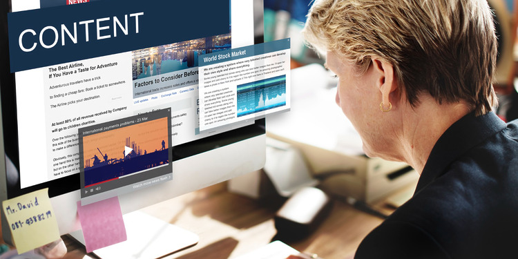 A woman working on a Content Management Platform.