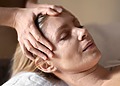 A woman going through a wrinkle relaxation and prevention treatment via botulinum-based neuromodulation.