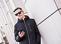Young men wearing wearable tech sunglasses