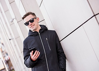 Young men wearing wearable tech sunglasses