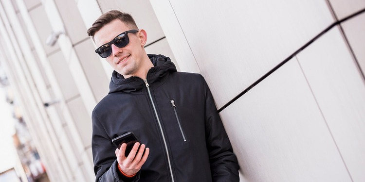 Young men wearing wearable tech sunglasses