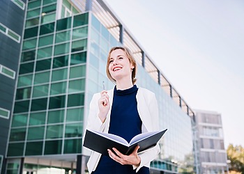 Young woman in front of her university.