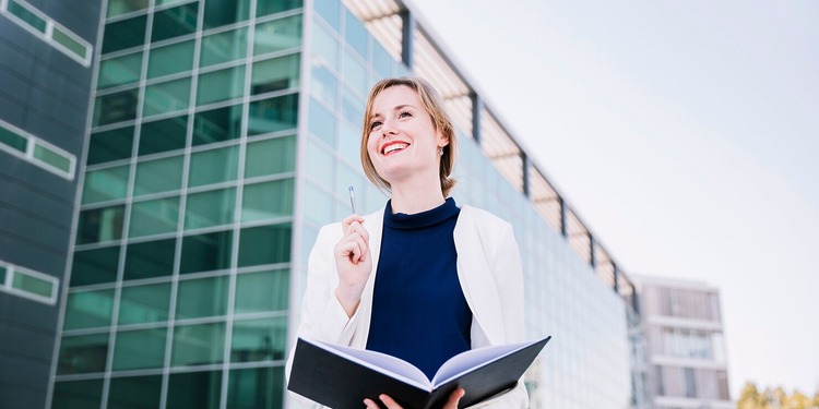 Young woman in front of her university.