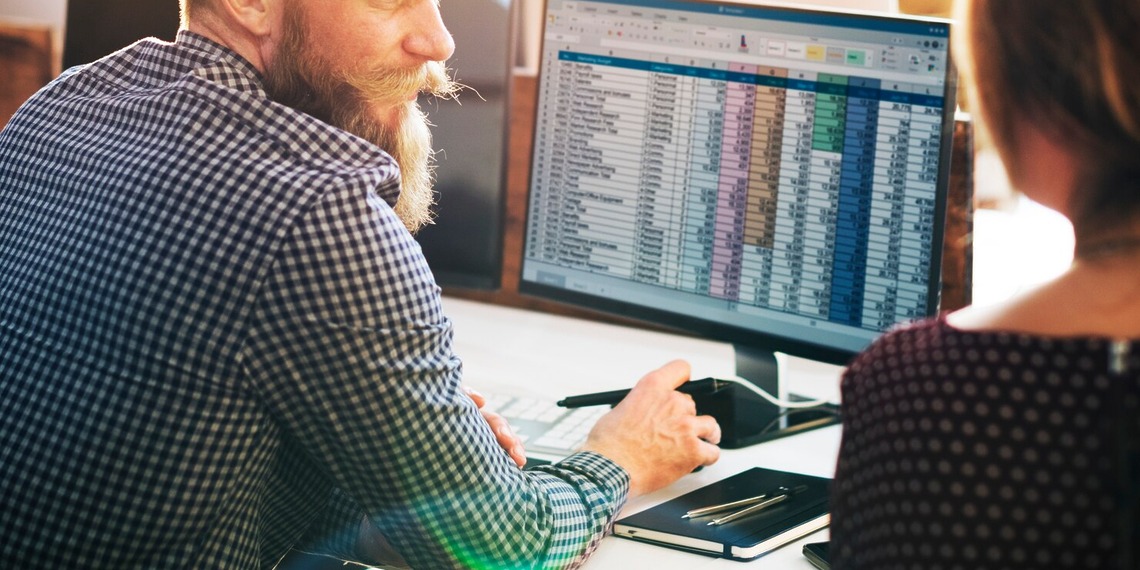 Men and woman working on their accounting Infrastructure