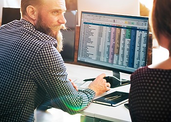 Men and woman working on their accounting Infrastructure