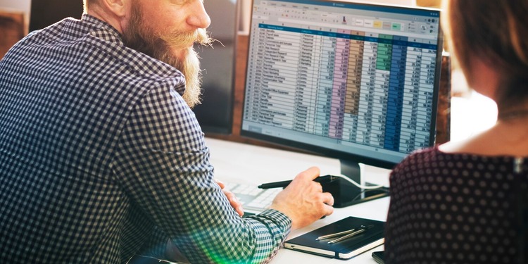 Men and woman working on their accounting Infrastructure