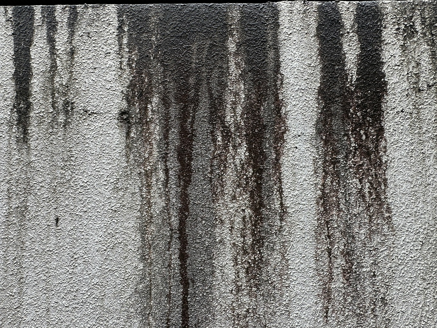 Soot stains on a concrete wall in the Philippines.