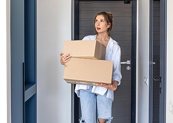 woman holding moving boxes