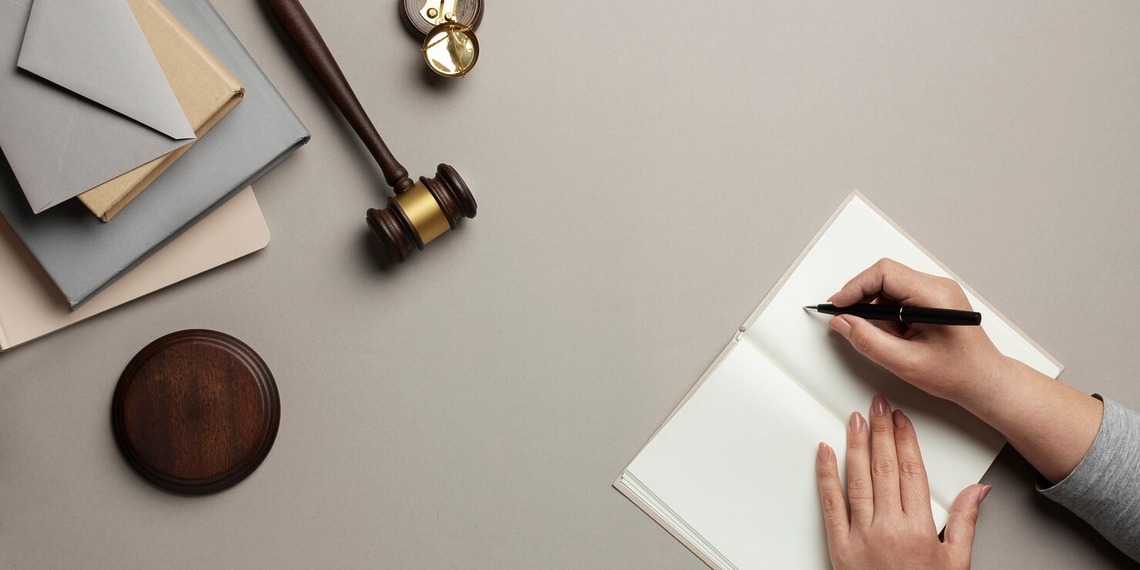 A gavel and a man drawing a list of Key Factors Judges Consider in Custody Cases.