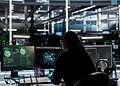 Woman at her desk with Safety Technology open on her computer screens.